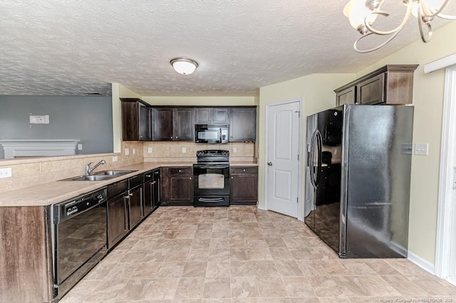 kitchen with tasteful backsplash, dark brown cabinetry, light countertops, black appliances, and a sink