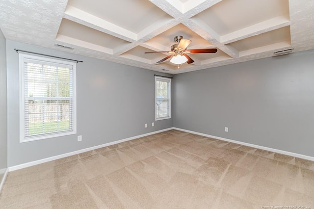 spare room with visible vents, baseboards, and carpet