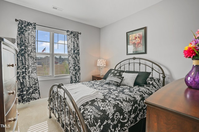 bedroom featuring carpet flooring, baseboards, and visible vents