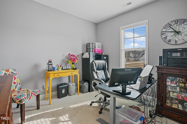 home office with visible vents, baseboards, and carpet