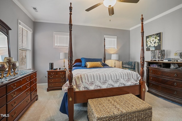 bedroom featuring a ceiling fan, light colored carpet, visible vents, and ornamental molding