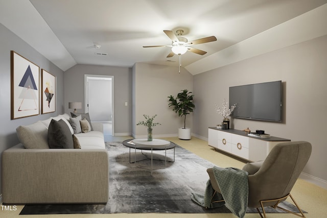 living room featuring baseboards, ceiling fan, and vaulted ceiling