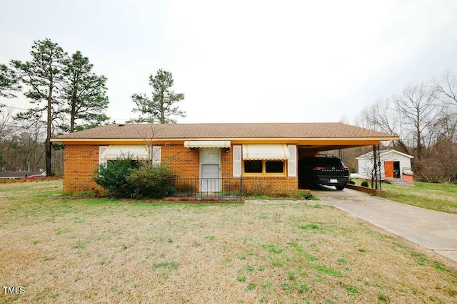 ranch-style home with an attached carport, brick siding, and a front lawn