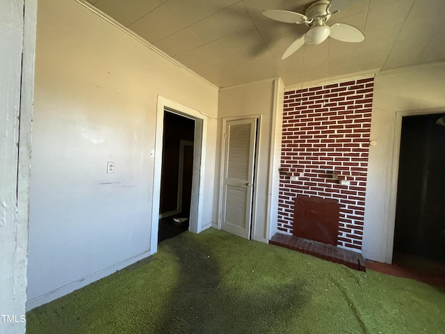 990 County Home Rd, Blanch, NC 27212 - carpeted spare room featuring crown molding, ceiling fan, and a fireplace