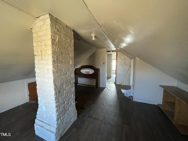 990 County Home Rd, Blanch, NC 27212 - additional living space with baseboards, wood finished floors, and lofted ceiling