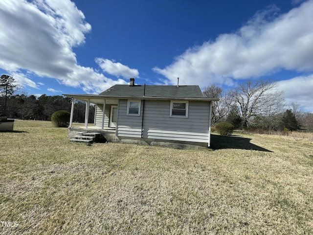 990 County Home Rd, Blanch, NC 27212 - back of property featuring covered porch and a lawn