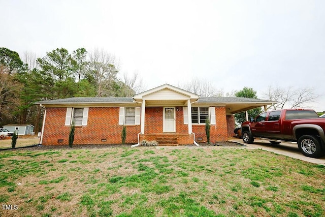 ranch-style home featuring a carport, crawl space, a front yard, and brick siding