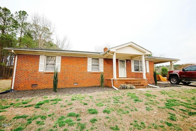 ranch-style house with brick siding, crawl space, and a front yard