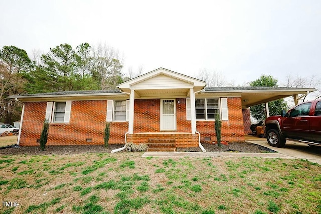 single story home with an attached carport, brick siding, and crawl space