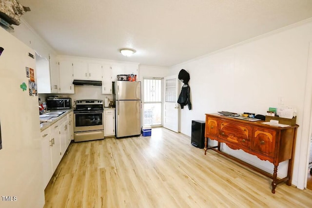 kitchen with light wood-style flooring, under cabinet range hood, appliances with stainless steel finishes, white cabinetry, and crown molding