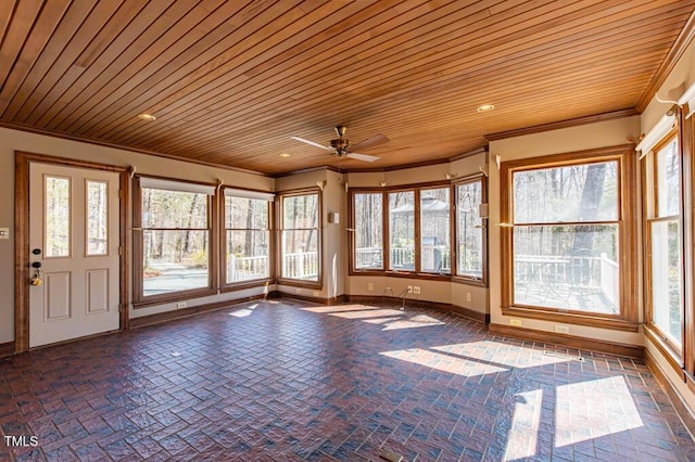 unfurnished sunroom with wood ceiling and ceiling fan