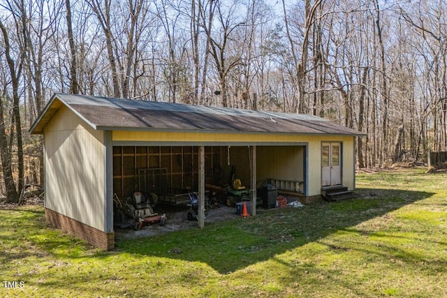 view of pole building featuring a detached carport and a yard