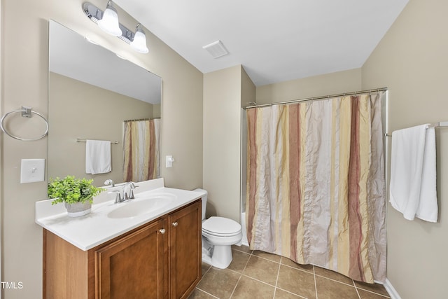 full bathroom featuring tile patterned floors, toilet, and vanity