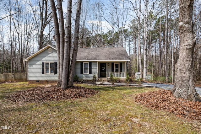 ranch-style house featuring crawl space, a porch, and a front yard