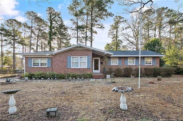 single story home with brick siding