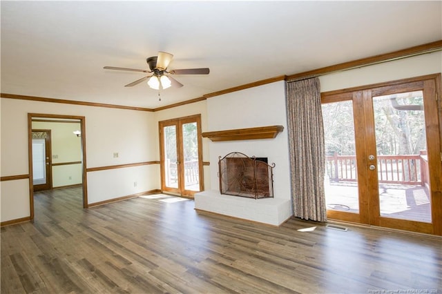 unfurnished living room featuring a wealth of natural light, french doors, wood finished floors, and a ceiling fan