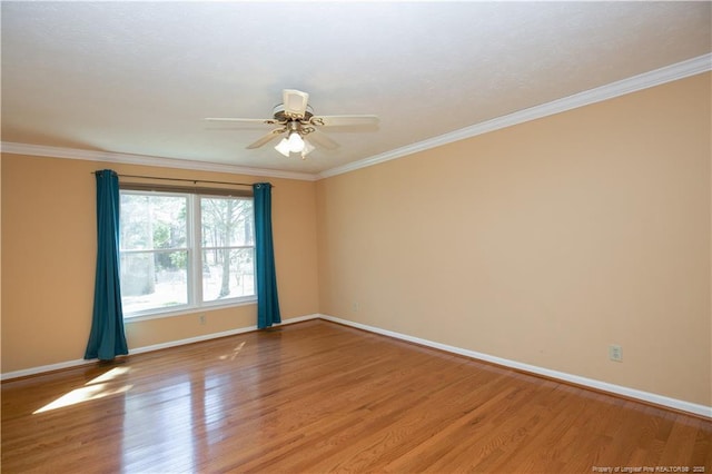 unfurnished room with light wood finished floors, ceiling fan, crown molding, and baseboards