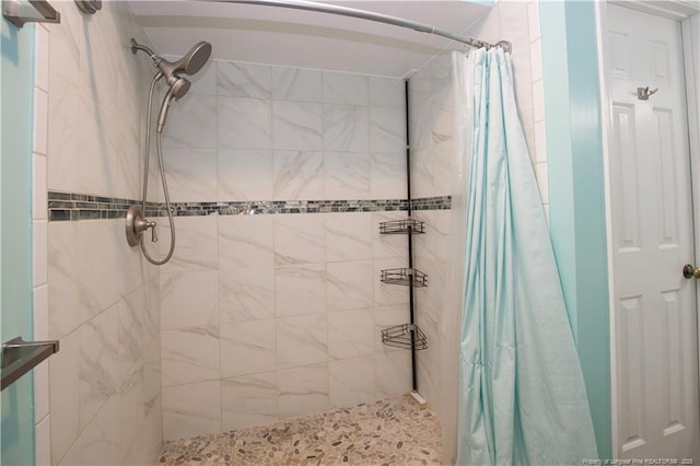 full bathroom with a tile shower