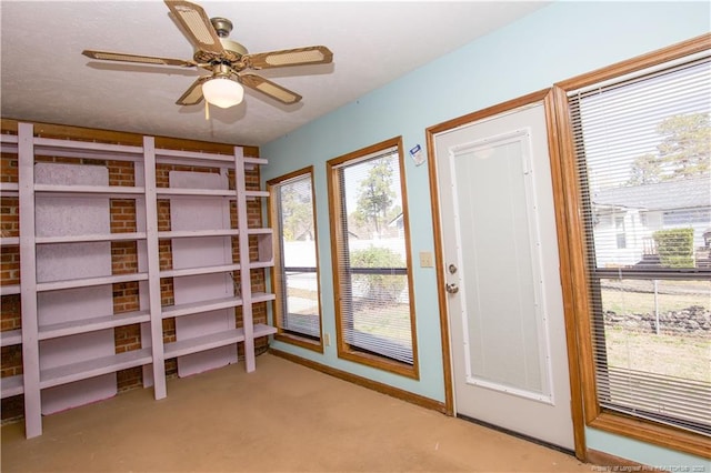 interior space with a ceiling fan