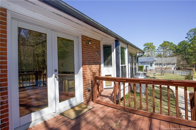 wooden terrace with french doors and fence