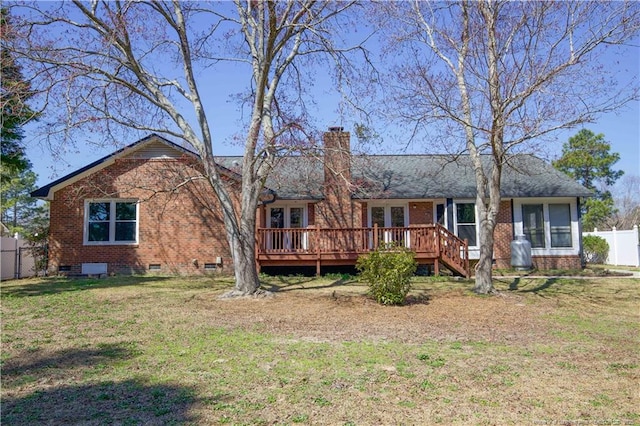 back of house featuring fence, a yard, a wooden deck, crawl space, and brick siding