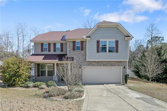 craftsman-style home with a garage, stone siding, driveway, and a shingled roof