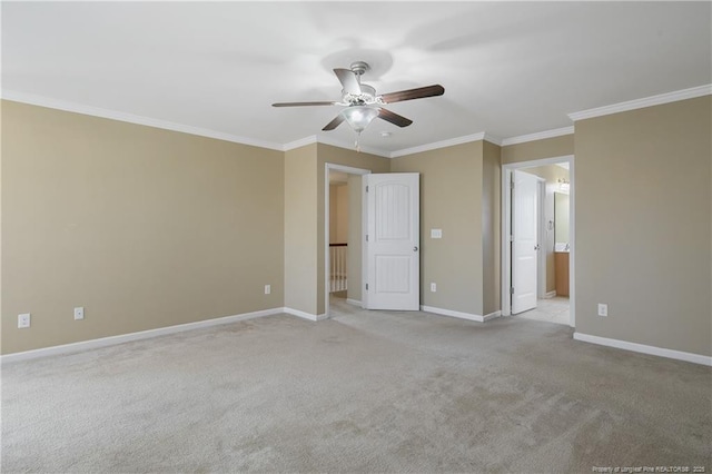 unfurnished bedroom with baseboards, ensuite bath, ceiling fan, crown molding, and light colored carpet