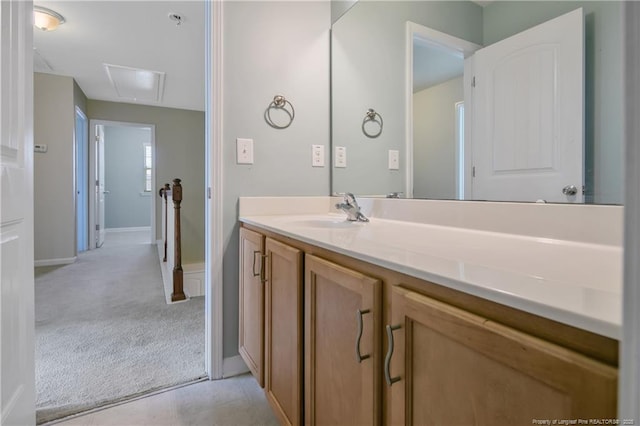 bathroom with tile patterned floors, vanity, and baseboards