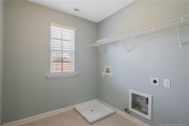 clothes washing area with electric dryer hookup, visible vents, washer hookup, baseboards, and laundry area