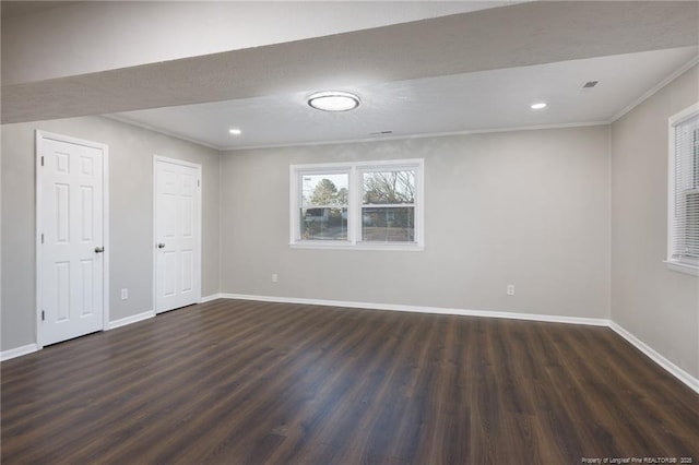 interior space featuring recessed lighting, dark wood-style floors, baseboards, and ornamental molding