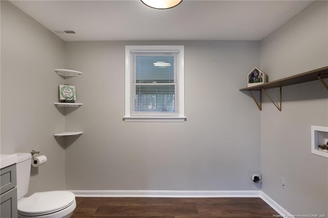 clothes washing area with visible vents, laundry area, baseboards, hookup for a washing machine, and dark wood-style flooring