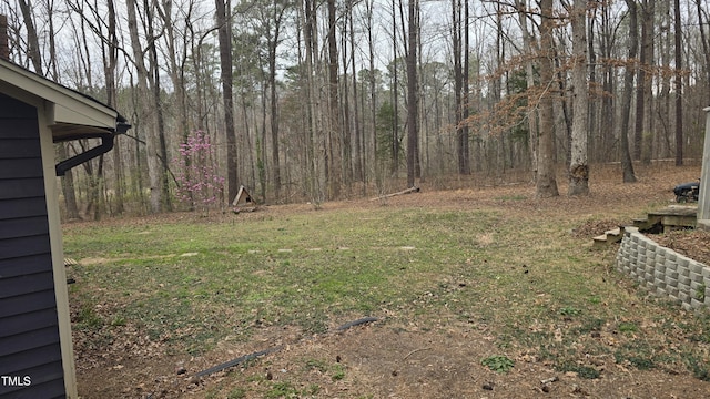 view of yard featuring a view of trees