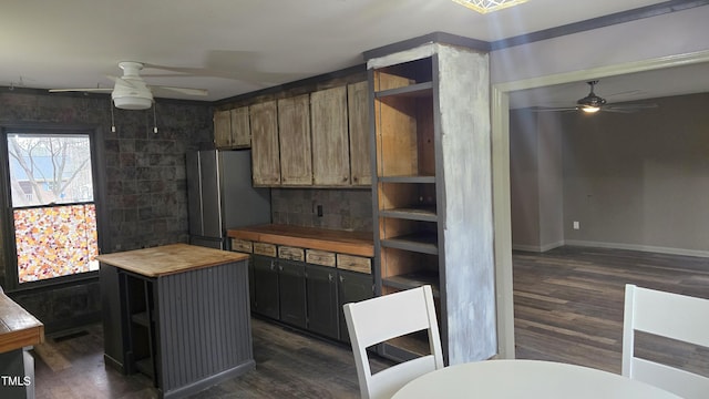 kitchen with wood counters, open shelves, freestanding refrigerator, and ceiling fan