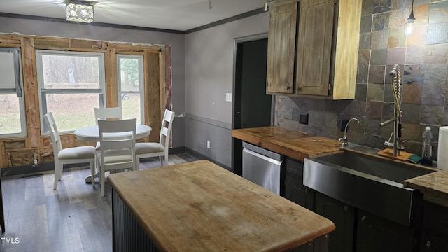 kitchen with wood finished floors, crown molding, decorative backsplash, wooden counters, and dishwasher