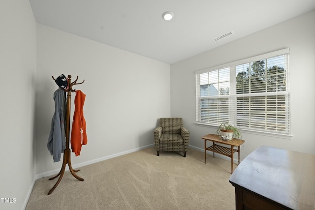 sitting room featuring visible vents, baseboards, and carpet flooring