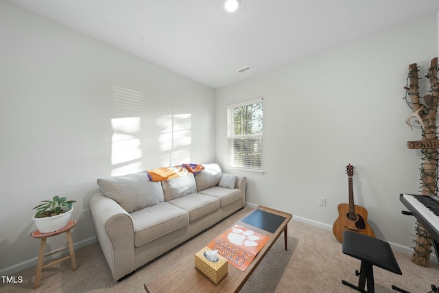 living room with vaulted ceiling, carpet flooring, visible vents, and baseboards