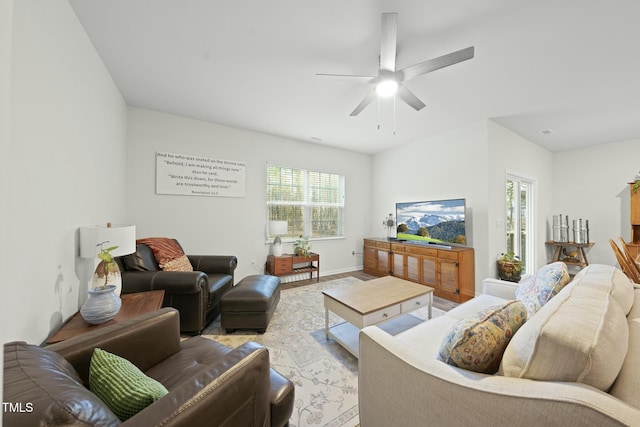 living room with light wood-style floors and a ceiling fan