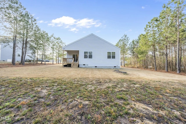 rear view of house with crawl space