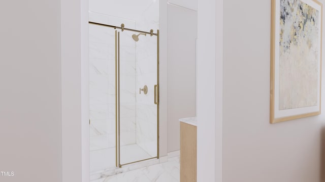 bathroom featuring a marble finish shower and marble finish floor