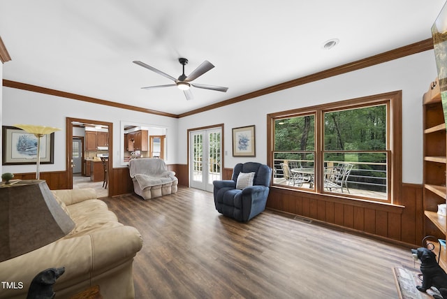 2705 Vestry Way, Raleigh, NC 27613 - living room with wainscoting, wood finished floors, ceiling fan, ornamental molding, and wooden walls