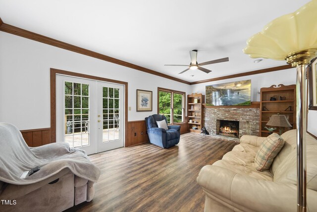 2705 Vestry Way, Raleigh, NC 27613 - living area with a wainscoted wall, french doors, wood finished floors, wooden walls, and ceiling fan