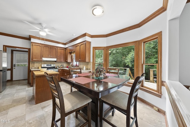 2705 Vestry Way, Raleigh, NC 27613 - dining area featuring crown molding, baseboards, and ceiling fan