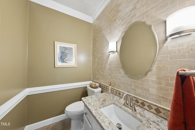 2705 Vestry Way, Raleigh, NC 27613 - half bathroom with ornamental molding, toilet, vanity, tile walls, and baseboards