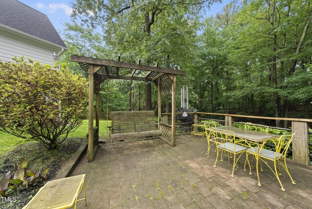 2705 Vestry Way, Raleigh, NC 27613 - wooden terrace featuring a pergola, outdoor dining area, and a patio