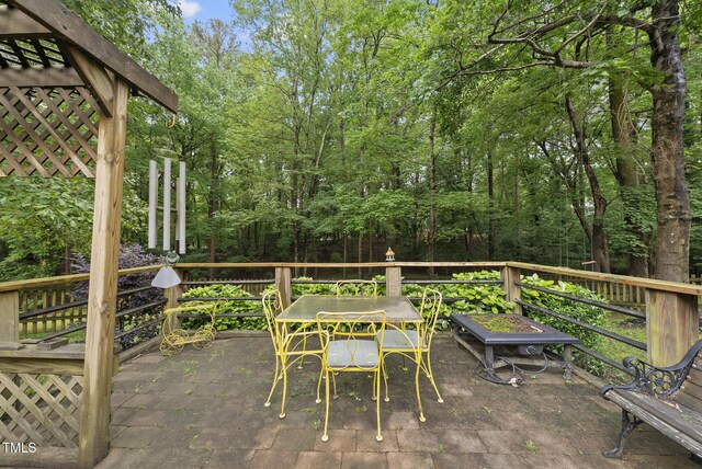 2705 Vestry Way, Raleigh, NC 27613 - wooden terrace with outdoor dining area