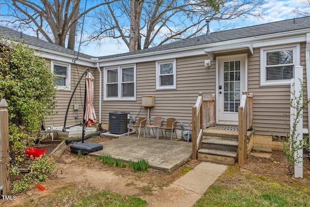 back of property featuring a patio area and central air condition unit