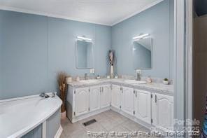 full bath with double vanity, a tub, crown molding, and a sink