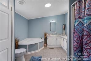 full bath with tile patterned floors, toilet, vanity, and a shower with curtain