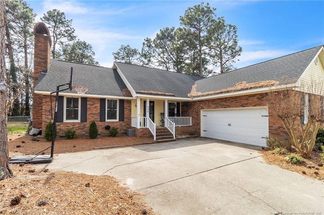 ranch-style house featuring brick siding, fence, concrete driveway, a chimney, and an attached garage