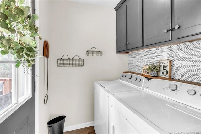 laundry area featuring cabinet space, independent washer and dryer, and baseboards